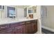 Bathroom featuring a double vanity with dark wood cabinets and modern countertops at 505 Vintage Way, Brandon, FL 33511