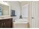 Bright bathroom with soaking tub, tiled floor, and vanity sink at 505 Vintage Way, Brandon, FL 33511