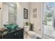 Modern bathroom featuring a unique glass bowl sink, granite countertop, and a glass-enclosed shower at 505 Vintage Way, Brandon, FL 33511