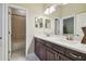 Bathroom featuring double vanity sink, shower, and tiled floor at 505 Vintage Way, Brandon, FL 33511