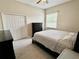 Bedroom with neutral walls and wood look floors at 505 Vintage Way, Brandon, FL 33511