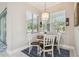 Cozy breakfast nook with a round wooden table and seating for four, illuminated by a pendant light at 505 Vintage Way, Brandon, FL 33511