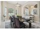 Inviting dining area with ample seating, stylish lighting, and plenty of natural light at 505 Vintage Way, Brandon, FL 33511