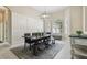 Dining room with decorative wainscoting, an elegant table, and bright windows at 505 Vintage Way, Brandon, FL 33511