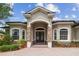 Elegant home entrance featuring a stone facade and a grand double door at 505 Vintage Way, Brandon, FL 33511