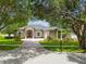 Beautifully landscaped home with mature trees providing shade and enhancing its curb appeal at 505 Vintage Way, Brandon, FL 33511
