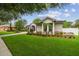 Well-maintained front lawn with manicured landscaping and a charming facade at 505 Vintage Way, Brandon, FL 33511