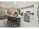 Spacious kitchen with white cabinetry, gray island, stainless steel appliances, and modern finishes at 505 Vintage Way, Brandon, FL 33511