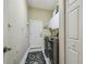 Bright laundry room equipped with modern washer and dryer units and ample storage at 505 Vintage Way, Brandon, FL 33511