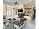 Bright and open living room with a fireplace, built-in shelving, ceiling fan, with access to the front entry at 505 Vintage Way, Brandon, FL 33511