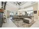 Spacious living area featuring a large sectional couch, stylish rug, and bright natural light at 505 Vintage Way, Brandon, FL 33511