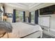 Bright main bedroom featuring wood floors, tray ceiling, and sliding glass doors to pool at 505 Vintage Way, Brandon, FL 33511
