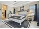 Spacious main bedroom featuring wood floors, tray ceiling, and ensuite bathroom access at 505 Vintage Way, Brandon, FL 33511