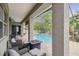 Covered patio with wicker furniture and pool view at 505 Vintage Way, Brandon, FL 33511