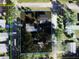 An aerial view showcasing the property lines and surrounding streets, including Ferris Avenue and Wood Street at 5105 Wood St, Zephyrhills, FL 33542