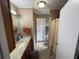 Bathroom featuring a granite vanity top, neutral decor, and a standing shower at 5105 Wood St, Zephyrhills, FL 33542