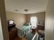 Guest bedroom features a single bed, storage, and natural light at 5105 Wood St, Zephyrhills, FL 33542