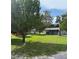 Well maintained lawn with a single story home in the background at 5105 Wood St, Zephyrhills, FL 33542