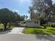 Charming single story home with a long driveway and mature trees at 5105 Wood St, Zephyrhills, FL 33542