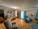 Comfortable living room with natural light, cozy seating, and a welcoming atmosphere at 5105 Wood St, Zephyrhills, FL 33542