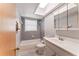 Bathroom with a bathtub, skylight and a single sink vanity at 5210 Dr Martin Luther King Jr St N St, St Petersburg, FL 33703