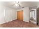 Bedroom with a closet, neutral paint and brown carpet at 5210 Dr Martin Luther King Jr St N St, St Petersburg, FL 33703