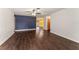 Bright and airy living room featuring hardwood floors and a ceiling fan, perfect for relaxing or entertaining guests at 5210 Dr Martin Luther King Jr St N St, St Petersburg, FL 33703
