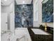 Elegant bathroom featuring a soaking tub, granite countertop vanity, and decorative tile accents at 5317 Lydia Ct, Spring Hill, FL 34608
