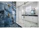Beautiful bathroom with dual vanity, granite countertops, and a modern tiled shower at 5317 Lydia Ct, Spring Hill, FL 34608