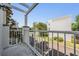 Balcony with white railings overlooking the street and nearby building, offering an outdoor living space at 5528 Liberty Plain Cir, Tampa, FL 33611