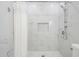 Elegant bathroom with a rainfall shower head, marble tiling, and pebble floor at 5528 Liberty Plain Cir, Tampa, FL 33611