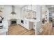 Modern kitchen featuring stainless steel appliances, light countertops, and wood-look floors at 5528 Liberty Plain Cir, Tampa, FL 33611