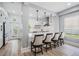 Open-concept kitchen with bar seating, modern appliances, and sleek finishes at 5528 Liberty Plain Cir, Tampa, FL 33611
