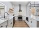 Stylish kitchen featuring a farmhouse sink, stainless steel appliances, and modern fixtures at 5528 Liberty Plain Cir, Tampa, FL 33611