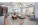 Inviting living space offers wood floors, neutral decor, and a clear view of the dining room at 5528 Liberty Plain Cir, Tampa, FL 33611