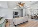 Open-concept living room with wood floors, modern furnishings, and views into the dining area at 5528 Liberty Plain Cir, Tampa, FL 33611