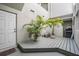 Private outdoor patio with potted palm trees, offering a serene and secluded space for relaxation at 5528 Liberty Plain Cir, Tampa, FL 33611