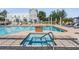 Community pool featuring a hot tub and comfortable lounge chairs, ideal for relaxation and socializing at 5528 Liberty Plain Cir, Tampa, FL 33611