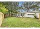 Spacious backyard with lush green grass and a privacy fence, perfect for outdoor activities at 5625 Atlantic N Ave, St Petersburg, FL 33703