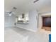 Bright living room featuring light wood floors and a view into a stylish kitchen at 5625 Atlantic N Ave, St Petersburg, FL 33703