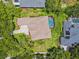 Aerial view of the home showcasing the roof, driveway, landscaping, and pool at 5823 Terncrest Dr, Lithia, FL 33547