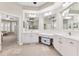 Bright primary bathroom boasts tile flooring, double vanities, and a central makeup area at 5823 Terncrest Dr, Lithia, FL 33547