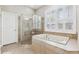 Primary bathroom featuring a separate shower, and a large soaking tub at 5823 Terncrest Dr, Lithia, FL 33547