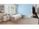 Serene bedroom with a tufted daybed, soft carpet, and bright natural light at 5823 Terncrest Dr, Lithia, FL 33547