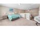 Cozy bedroom featuring neutral walls, plush carpet, and a comfortable sleeping area at 5823 Terncrest Dr, Lithia, FL 33547