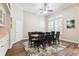 Formal dining room with hardwood floors, vaulted ceilings, shuttered windows, and a modern rug at 5823 Terncrest Dr, Lithia, FL 33547