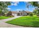 Lovely single-story home featuring lush front yard and well-maintained lawn with inviting driveway at 5823 Terncrest Dr, Lithia, FL 33547