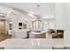 Bright, open concept kitchen with island, granite counters, stainless appliances, and views into the living spaces at 5823 Terncrest Dr, Lithia, FL 33547