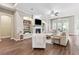 Bright living room featuring hardwood floors, a fireplace, and built-in shelving at 5823 Terncrest Dr, Lithia, FL 33547