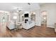 Warm living room with a fireplace, built-in bookshelves, hardwood floors, and natural light at 5823 Terncrest Dr, Lithia, FL 33547